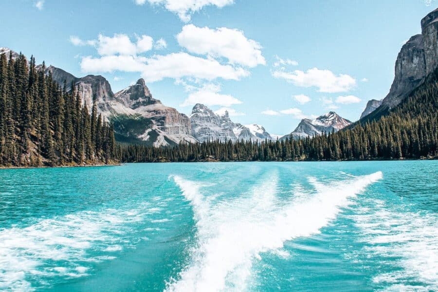 Maligne Lake surrounded by snow-capped mountain peaks is one of the most spectacular lakes in Western Canada