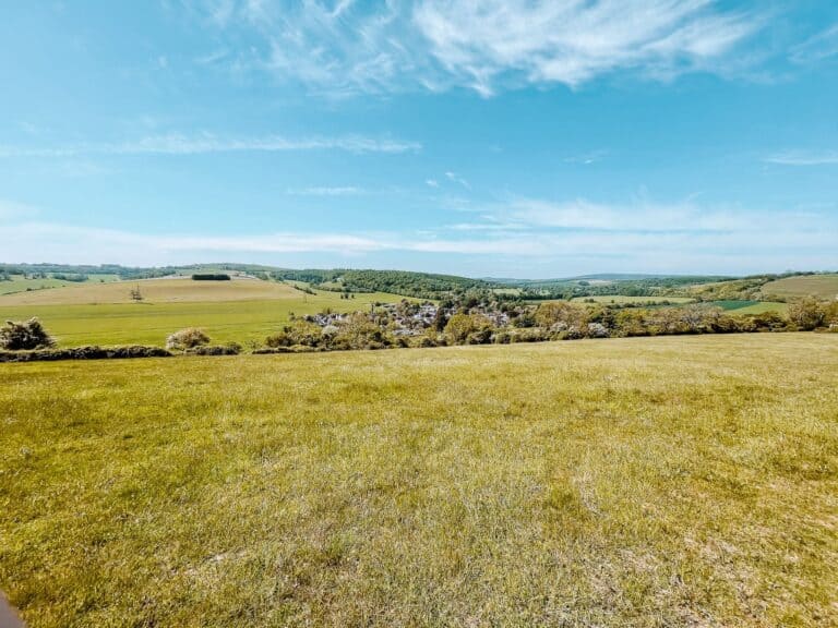 View from the top of the Levin Down Walk over the quaint village of Singleton, South Downs National Park, Sussex