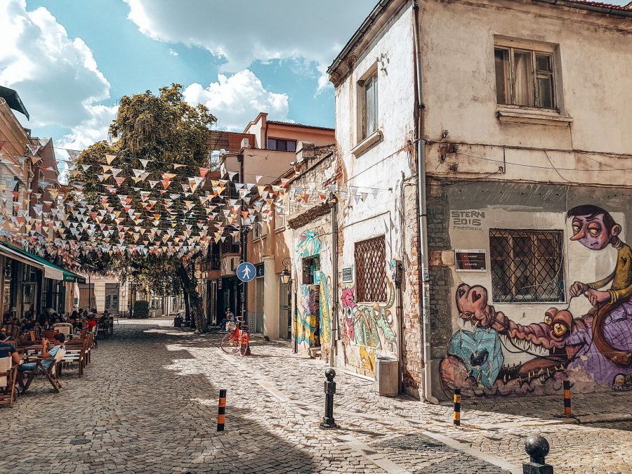 The flag-strewn cobbled streets of Kapana with vibrant street art, Plovdiv, Bulgaria