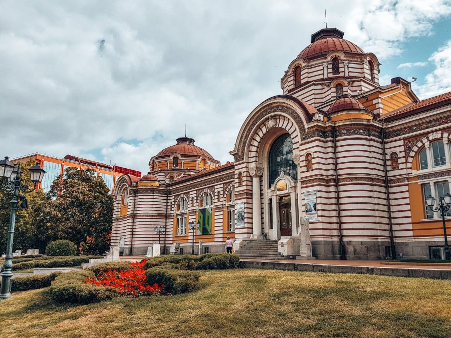 The vibrant yellow and red Regional History Museum, Sofia, Bulgaria