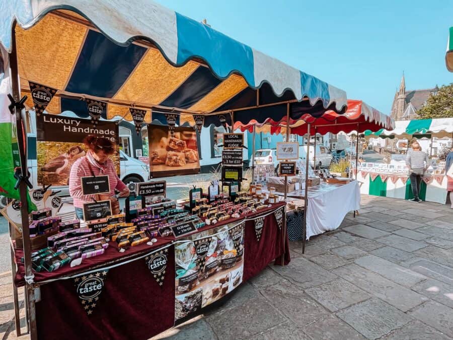 Colourful stalls of local produce at St Davids Market, Pembrokeshire, Wales