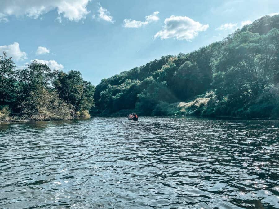 The peaceful River Wye nestled amongst thick dense greenery, the Wye Valley, Wales