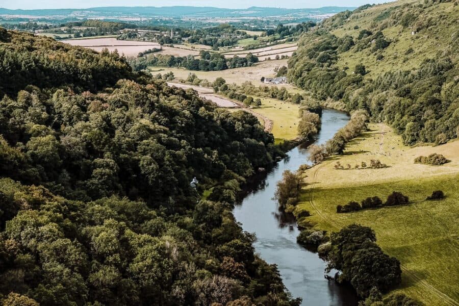 The Symonds Yat Viewpoint overlooking the tranquil River Wye and surrounding lush countryside is one of the best places to visit in the Wye Valley, Wales