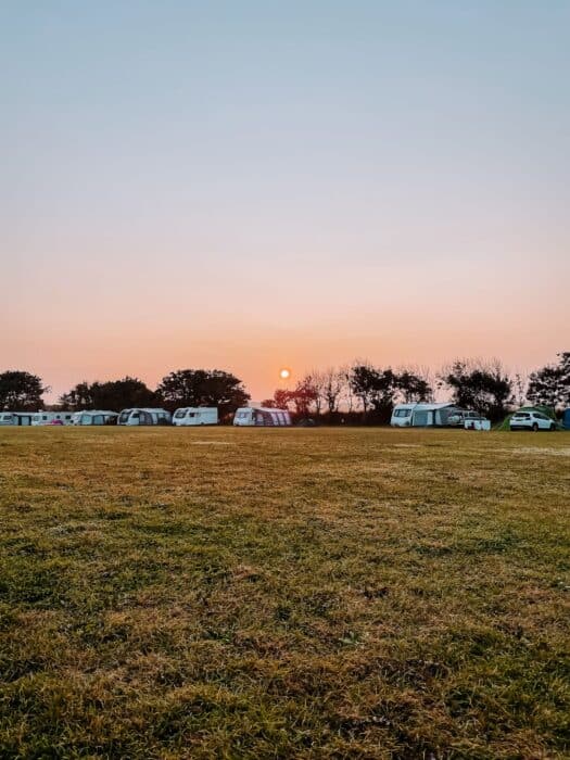 Fiery sunrise at Hendre Eynon Campsite, St Davids, Pembrokeshire, Wales, UK