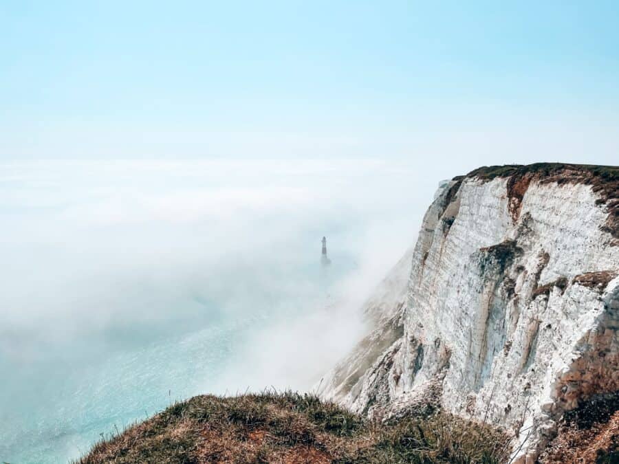 Mystical fog over Beachy Head Lighthouse, Seven Sisters Cliffs, Sussex, UK