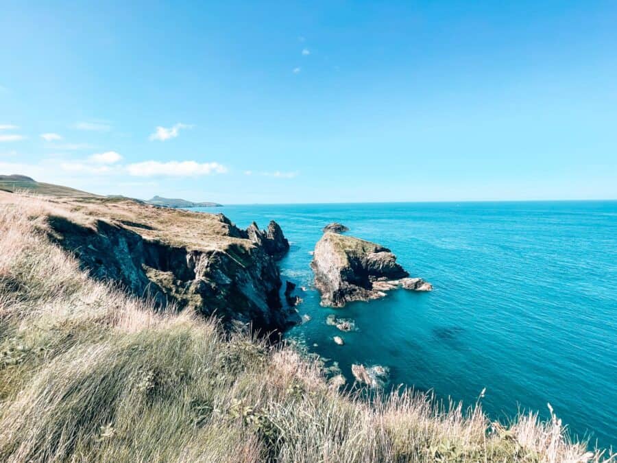 The striking turquoise ocean along the dramatic Pembrokeshire Coast Path is one of the top walking weekends in the UK, Wales