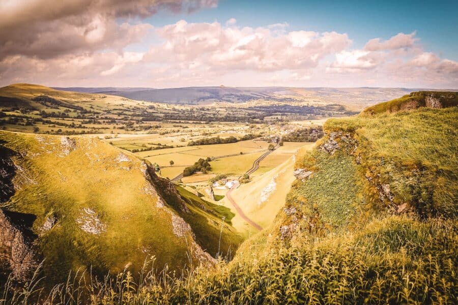 Panoramic view over the dramatic Winnats Pass across the endless countryside makes the Peak District one of the top walking weekends in the UK