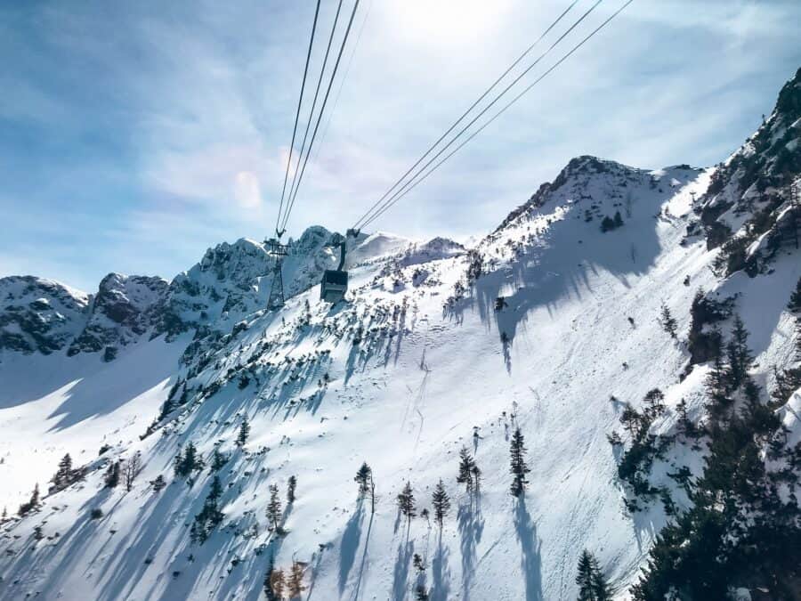 A cable car going up the snowy Tatra Mountains in winter in Zakopane, Poland