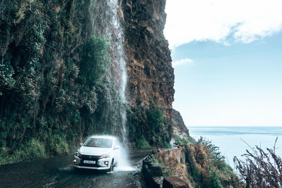 A car driving through Cascata dos Anjos is one of the most unique things to do in Madeira, Portugal