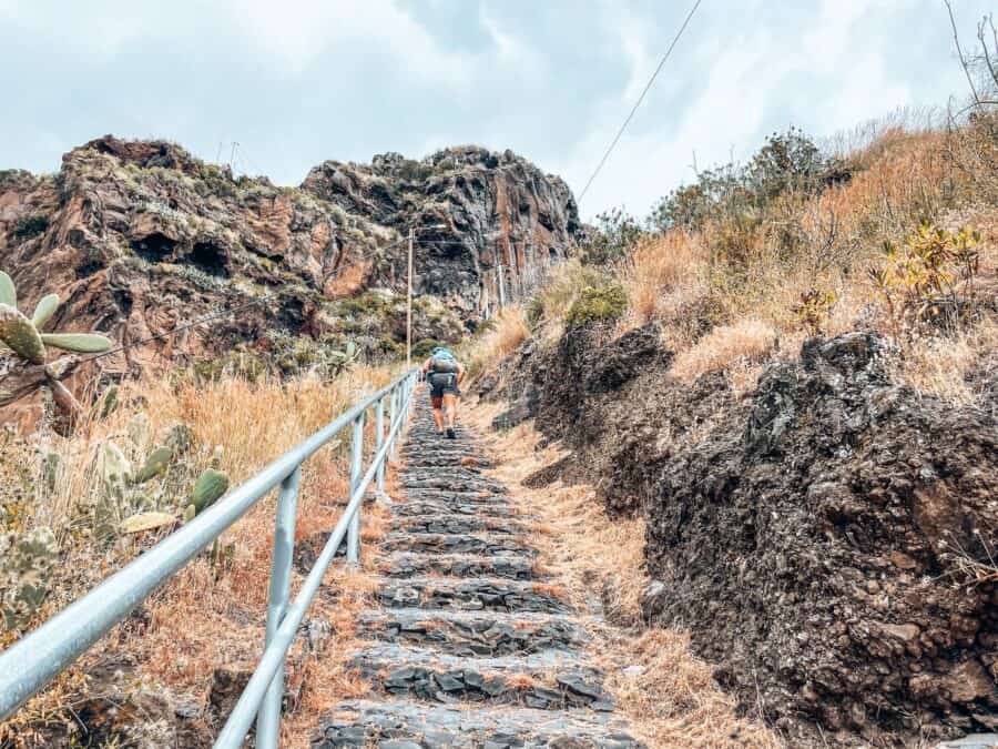 Andy climbing the steep stairs at Calhau da Lapa, Madeira, Portugal