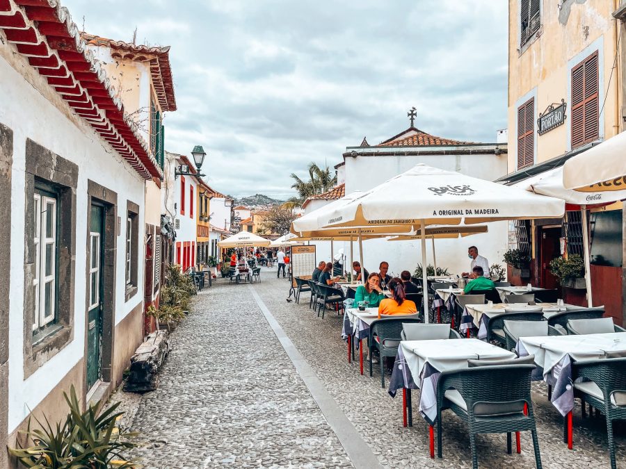 The narrow cobbled streets of Funchal's Old Town lined with bars and restaurants, Portugal