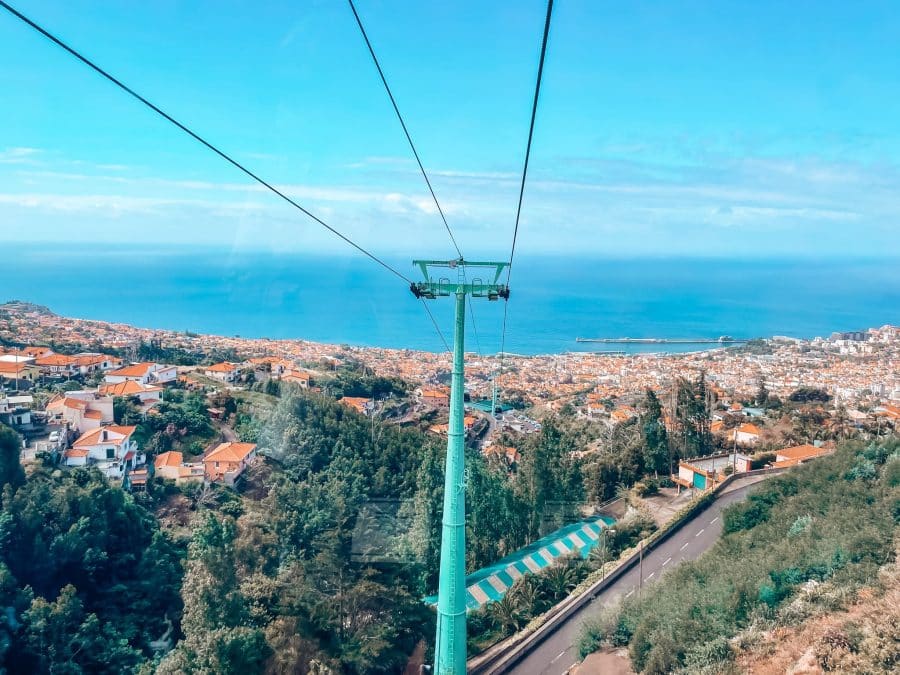 View from the top of the Funchal Cable Car over the red roofs and out to the Bay of Funchal, Madeira