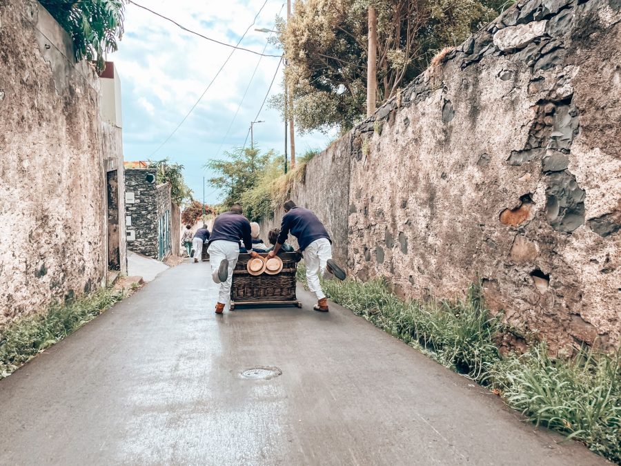 Tobogganing down the hill from Monte to Livramento in Funchal, Madeira, Portugal