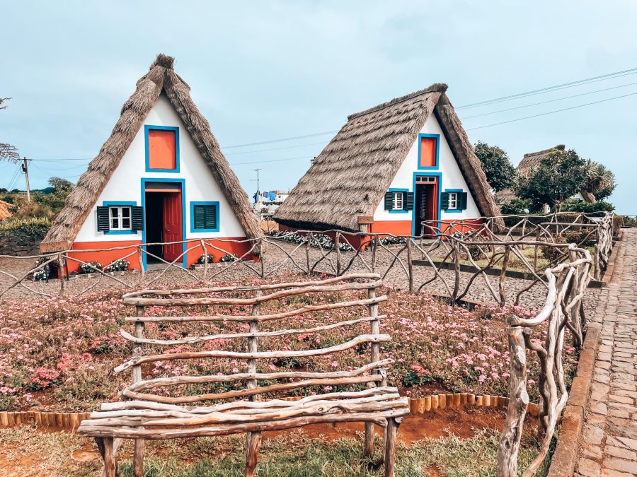 Two triangular white, red and blue houses, Casas de Santana, Madeira, Portugal