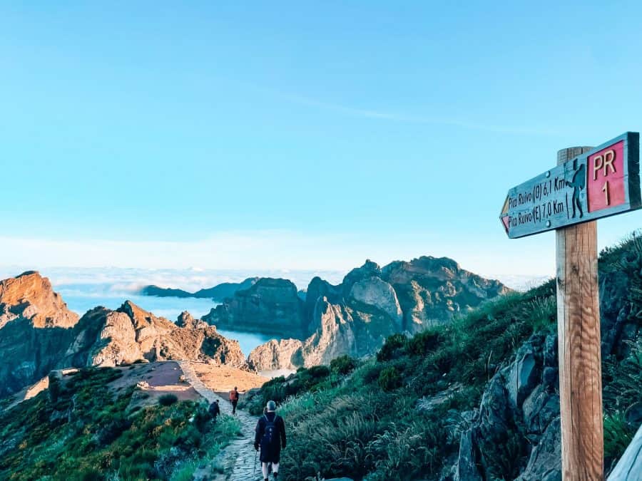 Start of the Pico do Arieiro to Pico Ruivo hike, floating clouds below the mountain peaks, Madeira, Portugal