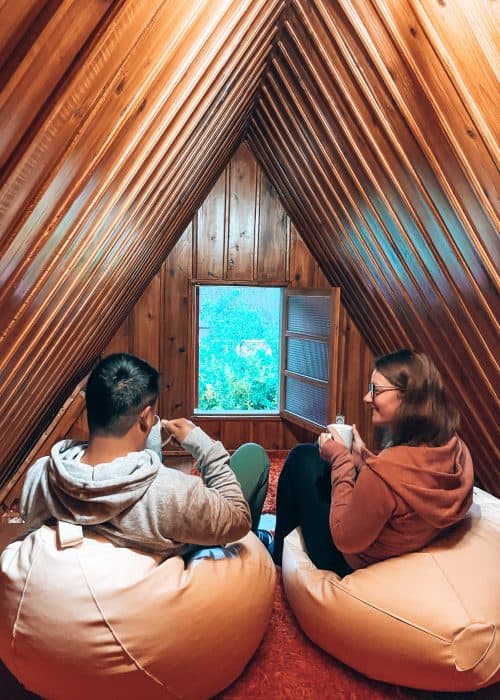 Andy and Helen sat on the beanbags in the attic of our traditional Santana house drinking our morning coffee, Madeira, Portugal