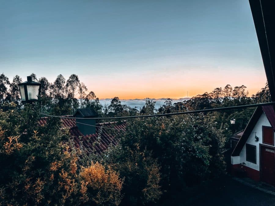 Sunrise above the clouds and a Casas de Santana, Madeira, Portugal