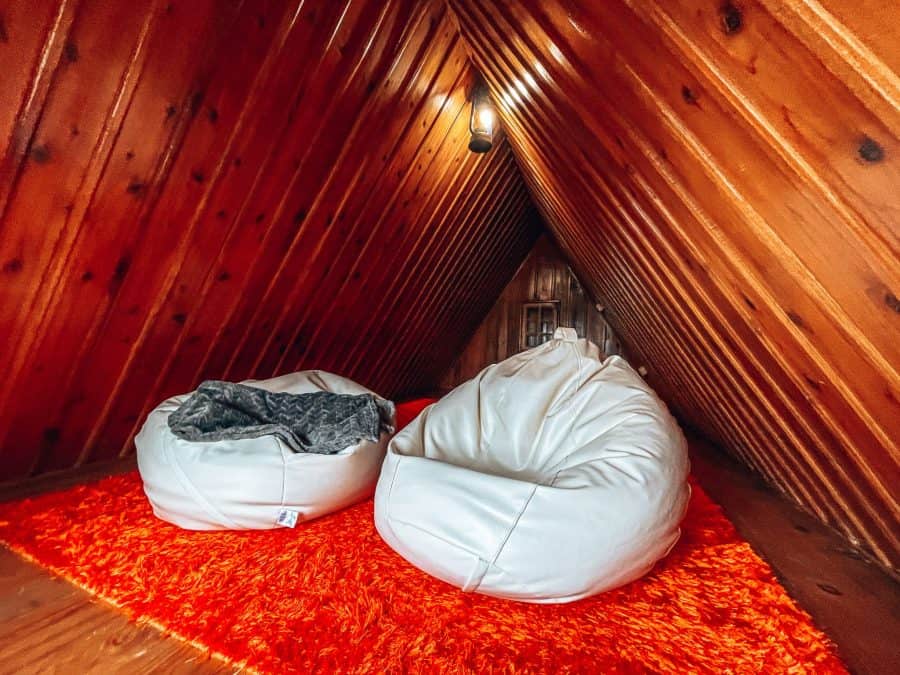 The cosy upstairs of our Traditional Santana House with two beanbags and blankets, Madeira, Portugal