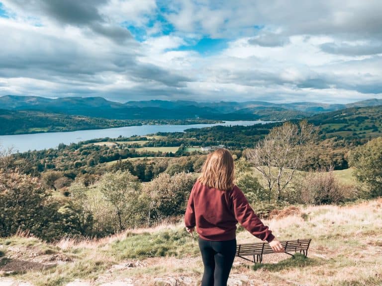 Helen stood at the peak of the Orrest Head Viewpoint overlooking Lake Windermere in the Lake District National Park, England