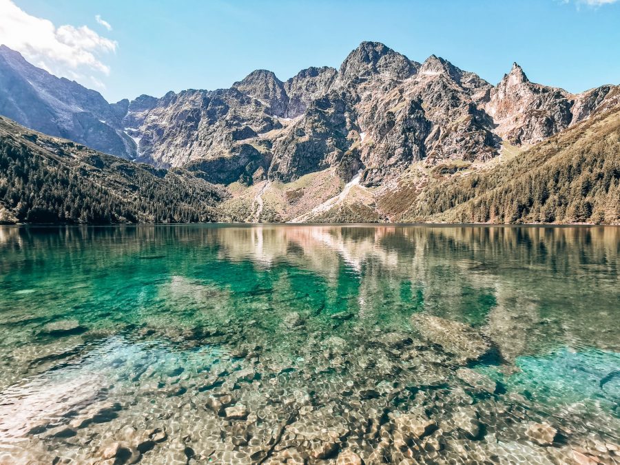 Shimmering turquoise Morskie Oko with a dramatic mountain backdrop is one of the best things to do in Zakopane, Poland