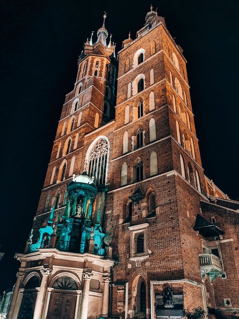 The imposing Gothic towers of St Mary's Basilica are one of the best places to visit in Krakow, Poland