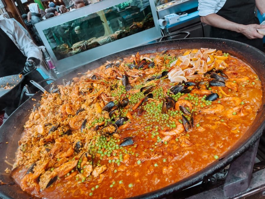 A huge portion of delicious looking paella being cooked at Borough Market, London Bridge, England, UK