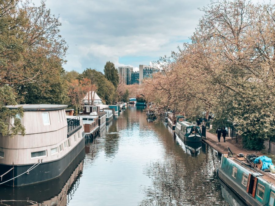 Narrowboats and trees line the waterways of Little Venice in North London, England, UK