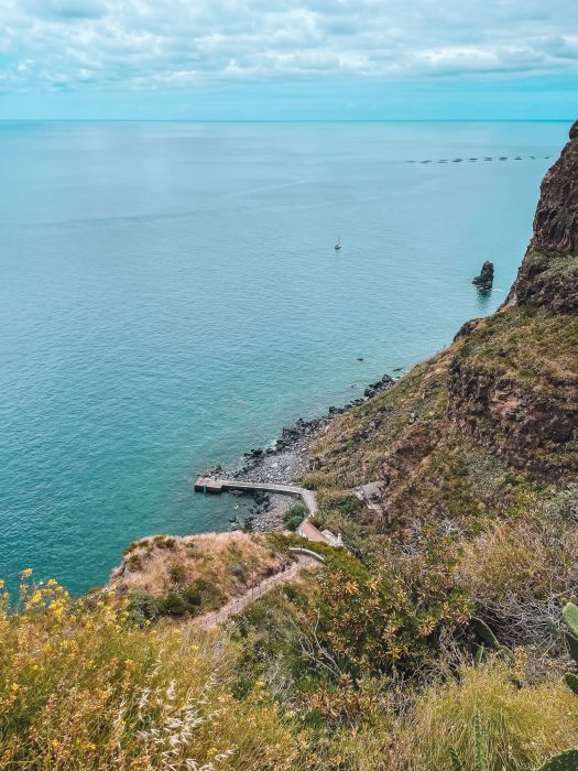 The view from the road down on Calhau da Lapa below the steep cliffs, places to see in Madeira, Portugal
