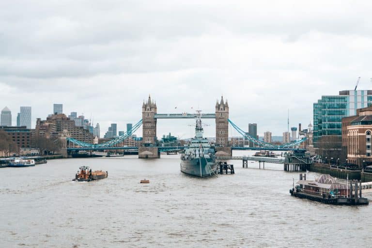 The view across the Thames to Tower Bridge with Canary Wharf's skyline in the background, London, England, UK