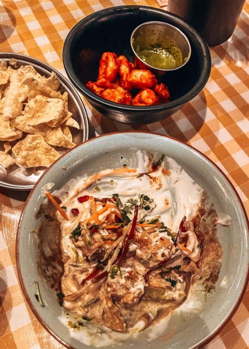 A selection of plates and bowls of delicious food from Dishoom, London