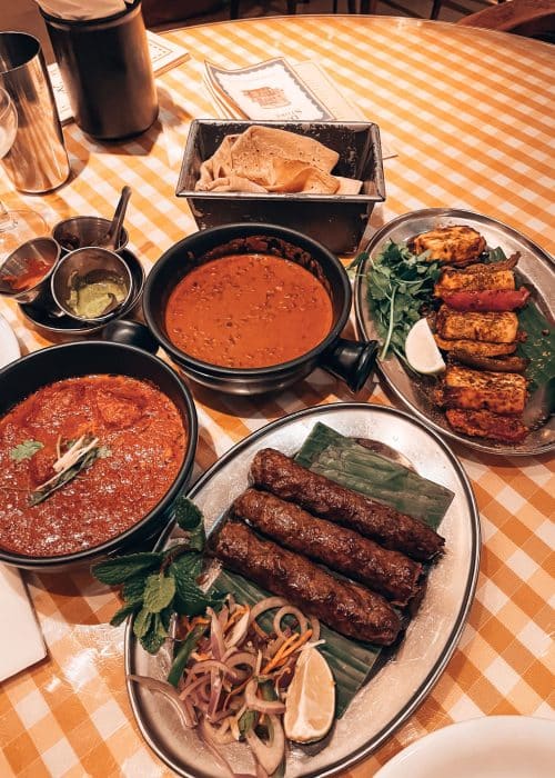 A selection of plates and bowls of delicious food from Dishoom, London