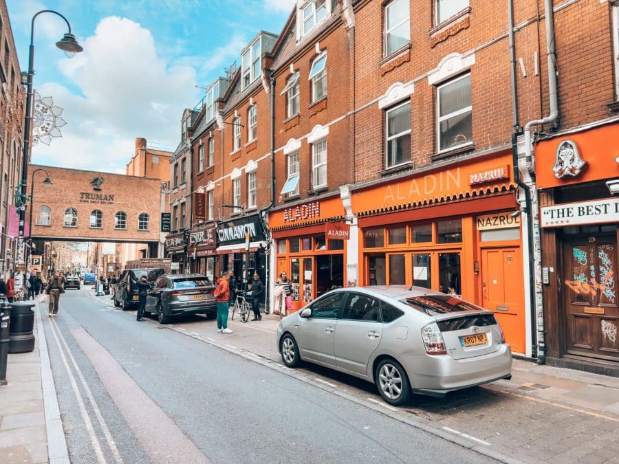 A line of curry houses on Brick Lane with our favourite restaurant, Aladin, London