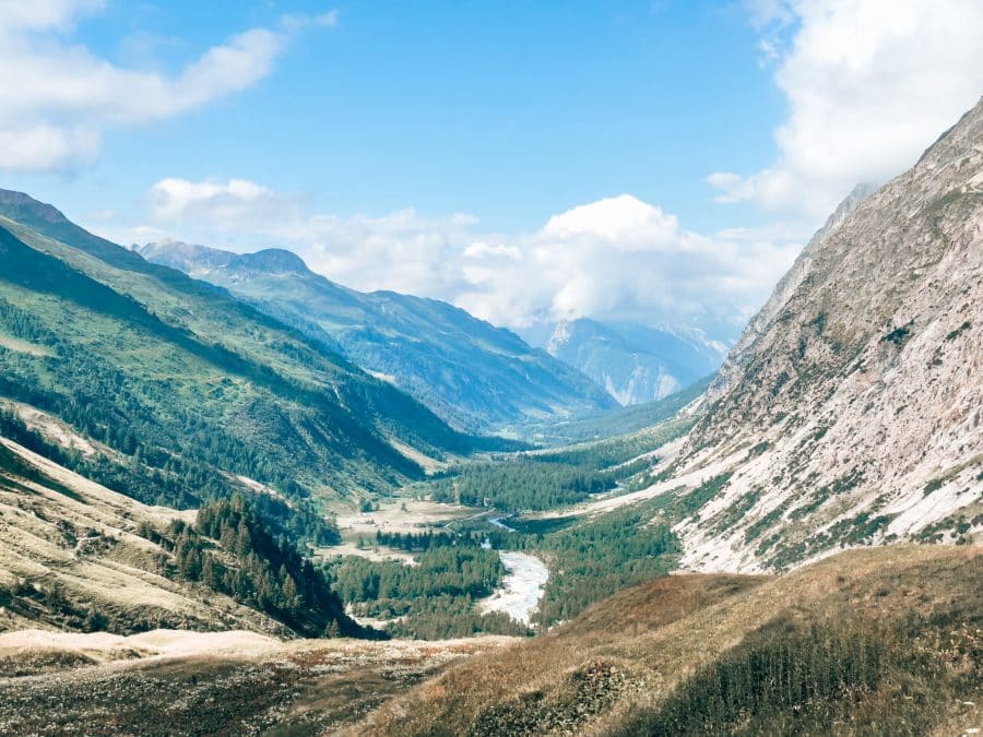 Hiking up the Grand Col Ferret with incredible views over the surrounding mountains and into the valley below while hiking the TMB, Courmayeur, Aosta Valley, Tour du Mont Blanc, Italy