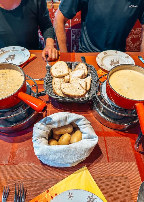 Two delicious cheese fondues with bread and potatoes at Auberge-restaurant des Glaciers in La Fouly, Tour du Mont Blanc, Switzerland