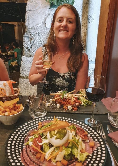 Helen eating dinner in Les Chineurs de la Cuisine across from Andy in Annecy Old Town, France