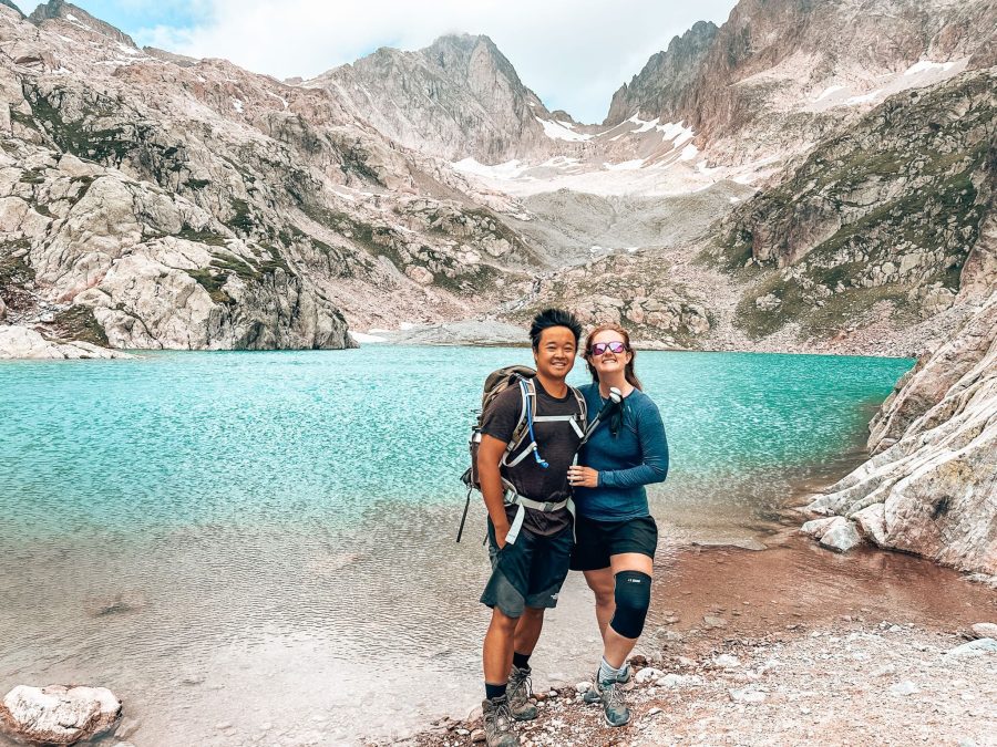 Helen and Andy standing on the shore of Lac Blanc with snow-capped peaks in the background, Chamonix, France