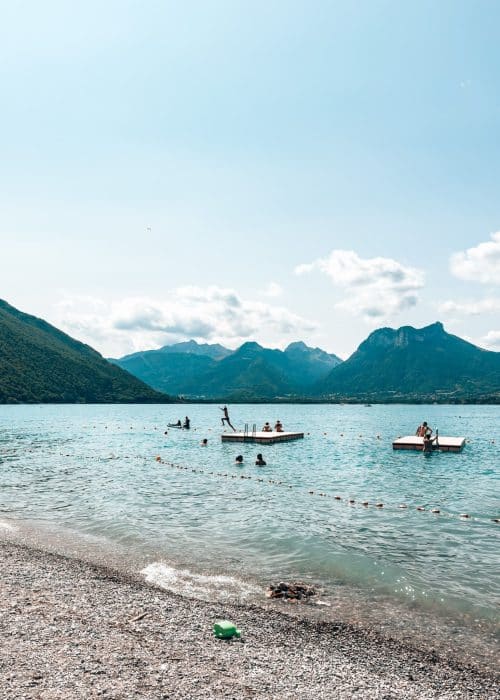 One of the best beaches on Lake Annecy is Angon Beach with it's dramatic mountain backdrop and pontoons, Annecy, France