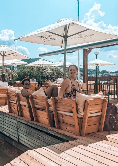 Helen and Andy on the chairs in the bar of Le Pop Plage by Lake Annecy on Imperial Beach, France