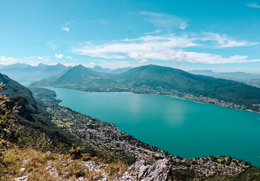 A birds-eye view over the piercing blue Lake Annecy from one of the surrounding mountains, France