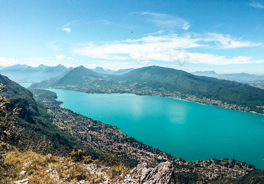 A birds-eye view over the piercing blue Lake Annecy from one of the surrounding mountains, France