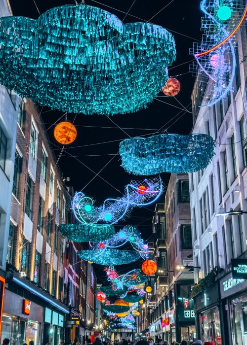 Carnaby Universe lighting up the street with lots of colourful planets, Carnaby Street at Christmas, London, UK