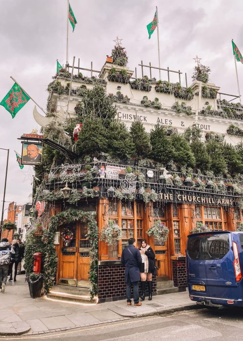 The exterior of the Churchill Arms with 0ver 80 Christmas trees and thousands of lights in Kensington, London