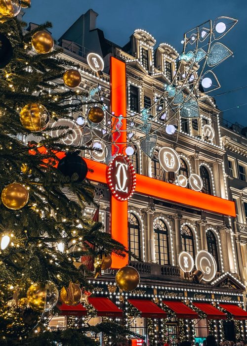 The exterior of Cartier dressed up a huge present behind a Christmas tree is always a favourite at Christmas in London