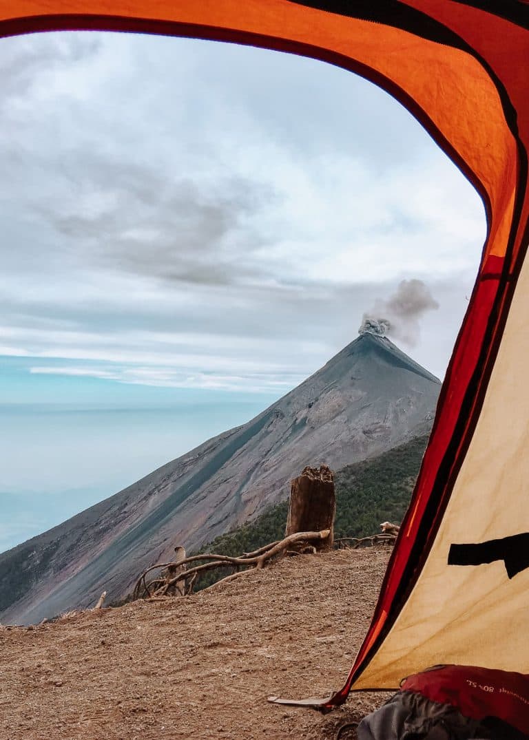 The view from inside our tent at basecamp on Volcan Acatenango to Volcan Fuego erupting, Guatemala