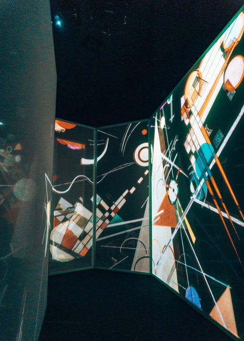 See-through screens with lots of colourful shapes on in the Art of Abstraction gallery at Frameless, one of the best immersive experiences in London