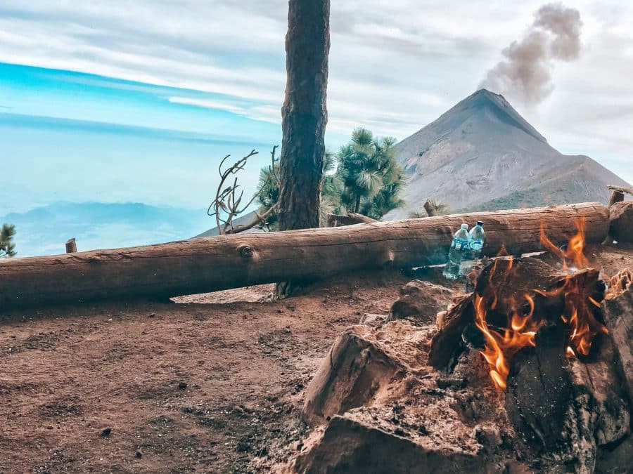 Acatenango Volcano base camp bonfire overlooking the constant eruptions of Volcan Fuego is one of the best things to do in Guatemala, Central America