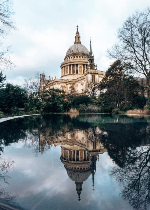 St Paul's dome perfectly reflected in an oval pool, the focal feature of Reflection Garden, one of the best free things to do in London