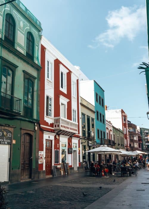 Bright coloured buildings on a narrow street in Vegueta, Las Palmas, Gran Canaria itinerary