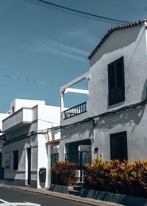 White-washed buildings with flowers outside in Agaete, Gran Canaria