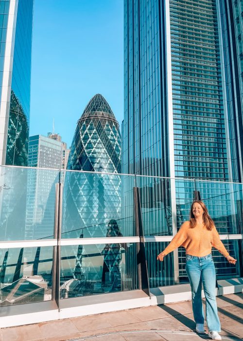 Helen stood in front of The Gherkin on the roof of Garden at 120 Fenchurch Street, London